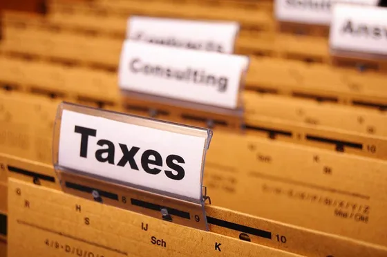 File folders with a taxes label and a consulting label visible.